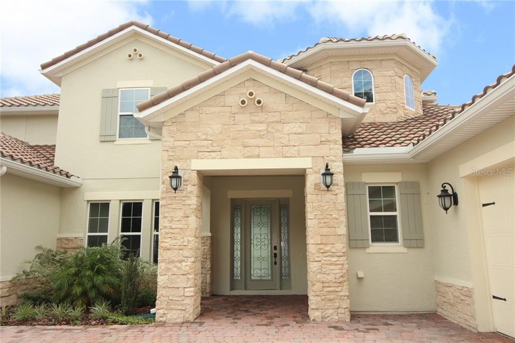 New Lakefront Mansion with 4 car garage in Bellalago Kissimmee 729,000