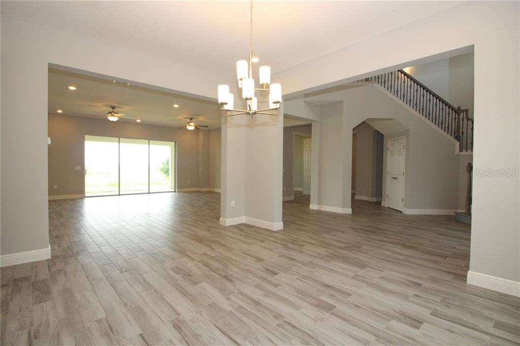 New Lakefront Mansion with 4 car garage in Bellalago Kissimmee 729,000