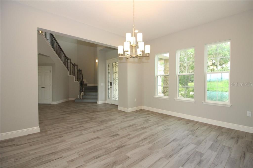 New Lakefront Mansion with 4 car garage in Bellalago Kissimmee 729,000