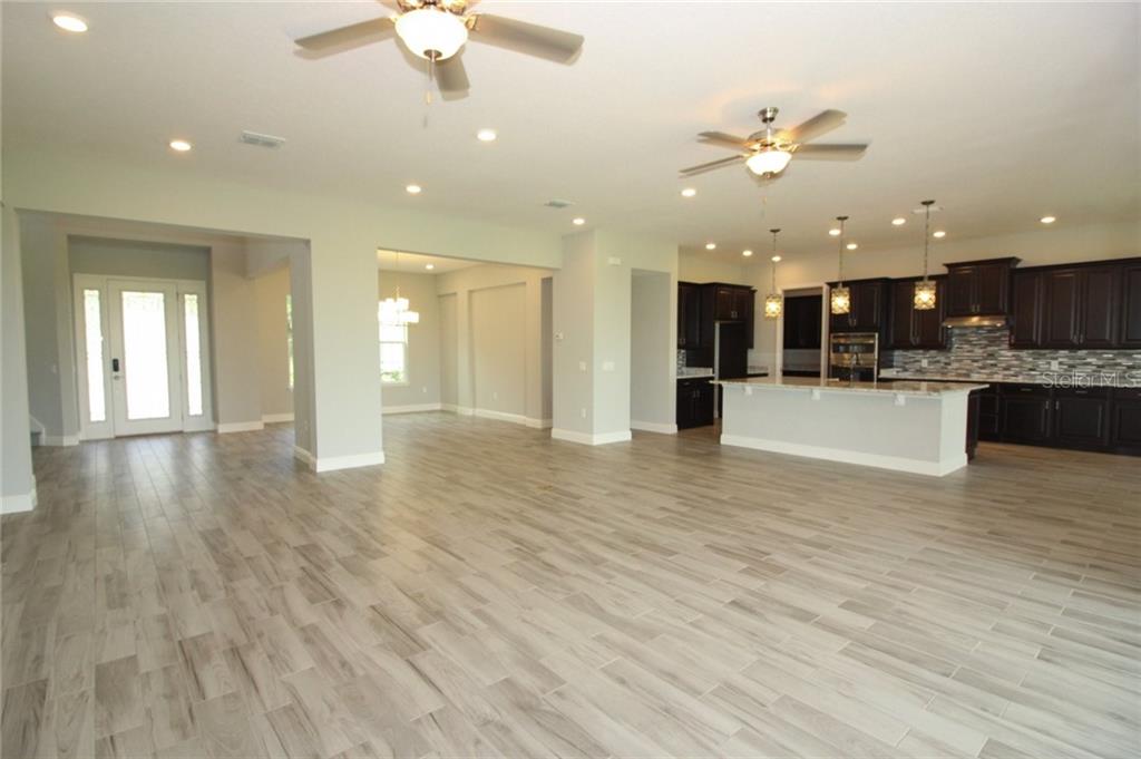 New Lakefront Mansion with 4 car garage in Bellalago Kissimmee 729,000