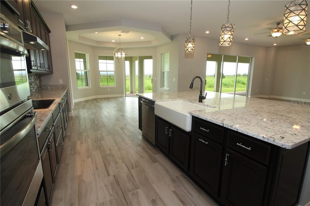 New Lakefront Mansion with 4 car garage in Bellalago Kissimmee 729,000